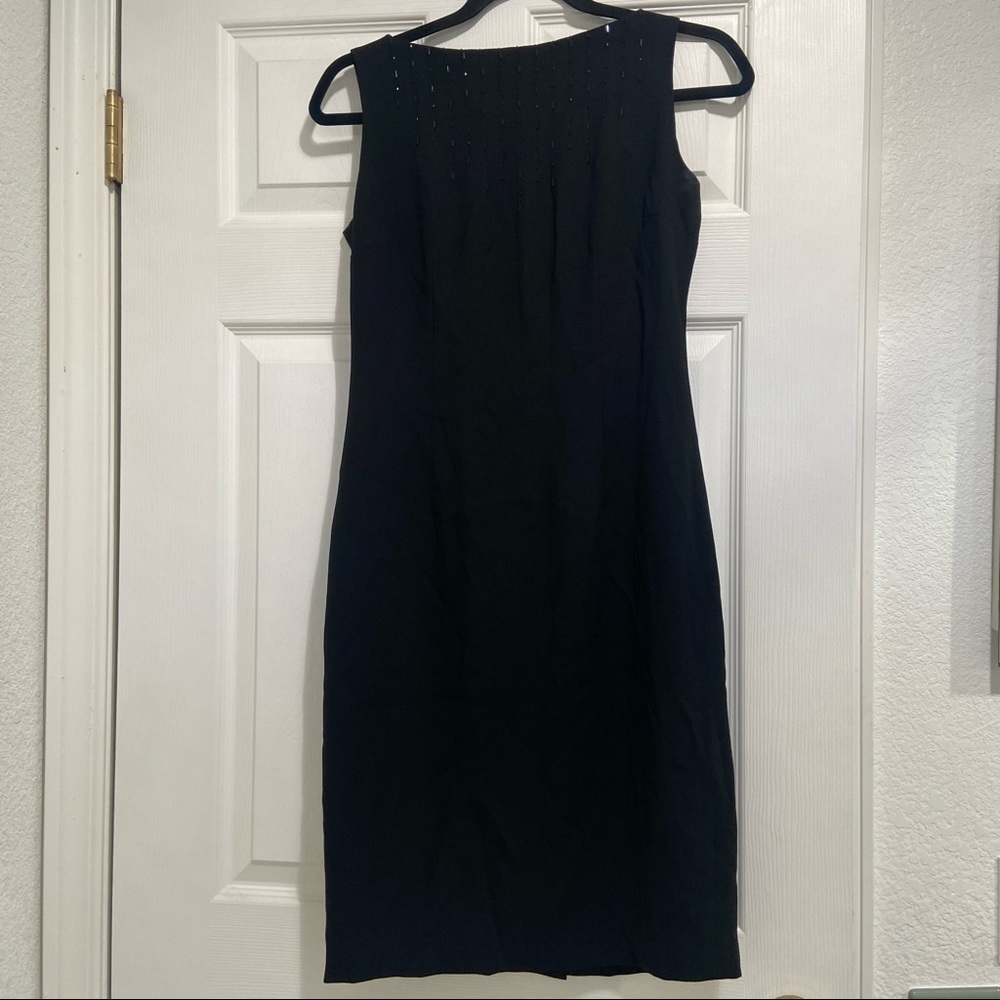 Beaded black dress. Simple and modest chest size 4